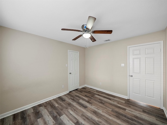 1409 Rivercrest Blvd, Allen, TX 75002 - unfurnished room with dark wood finished floors, a ceiling fan, and baseboards