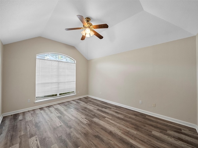 1409 Rivercrest Blvd, Allen, TX 75002 - spare room with a ceiling fan, vaulted ceiling, dark wood-style floors, and baseboards