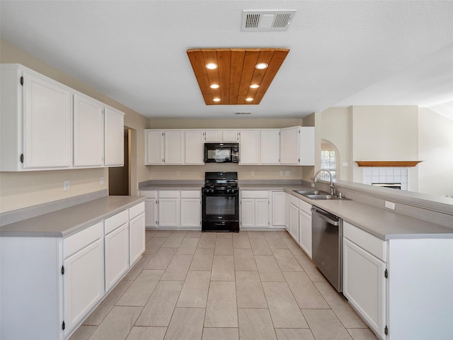 1409 Rivercrest Blvd, Allen, TX 75002 - kitchen with black appliances, a sink, a peninsula, white cabinetry, and recessed lighting