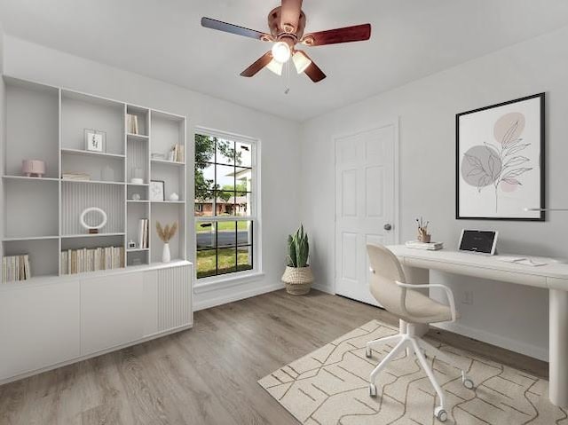 6825 John Dr, Richland Hills, TX 76118 - office with wood finished floors, a ceiling fan, baseboards, and built in study area