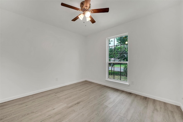 6825 John Dr, Richland Hills, TX 76118 - unfurnished room featuring wood finished floors, baseboards, and a ceiling fan