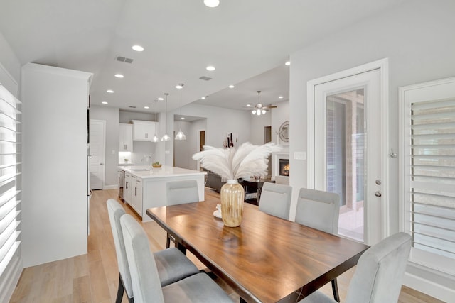 504 Arrowhead Ln, Haslet, TX 76052 - dining area featuring light wood-style floors, recessed lighting, and ceiling fan