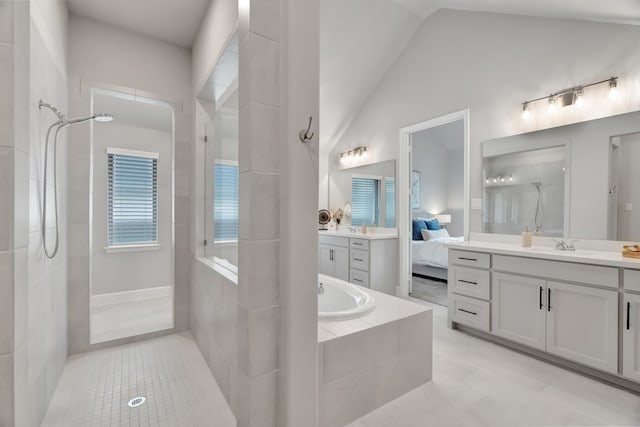 504 Arrowhead Ln, Haslet, TX 76052 - bathroom with walk in shower, vanity, lofted ceiling, and a garden tub