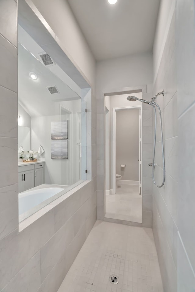 504 Arrowhead Ln, Haslet, TX 76052 - full bathroom with a tile shower, vanity, and tile patterned floors