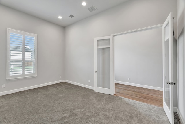 504 Arrowhead Ln, Haslet, TX 76052 - unfurnished bedroom with french doors, carpet, and recessed lighting
