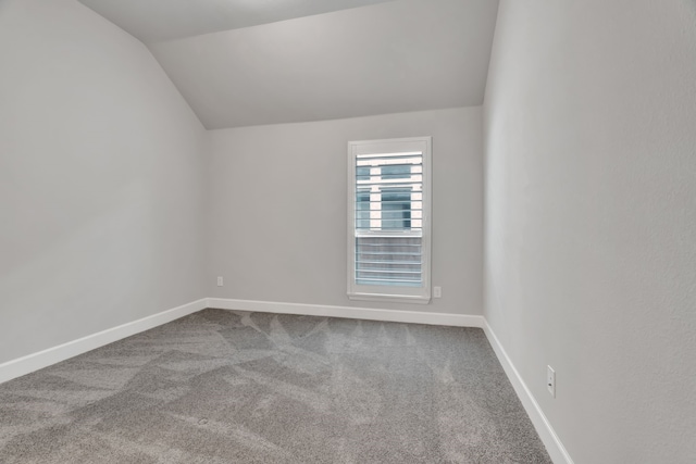 504 Arrowhead Ln, Haslet, TX 76052 - bonus room featuring carpet and lofted ceiling