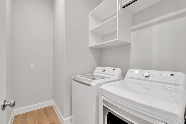 504 Arrowhead Ln, Haslet, TX 76052 - washroom with washer and dryer and light wood-type flooring