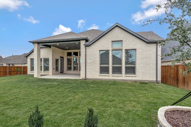 504 Arrowhead Ln, Haslet, TX 76052 - rear view of property with a fenced backyard, roof with shingles, a patio area, and brick siding