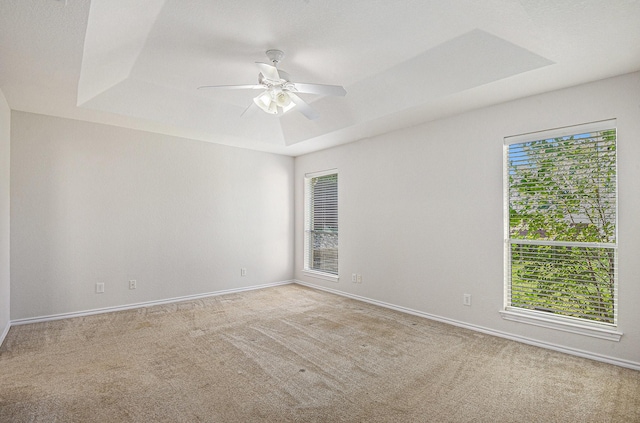 2109 Timber Cove Ct, Weatherford, TX 76087 - unfurnished room with carpet, a raised ceiling, ceiling fan, and baseboards