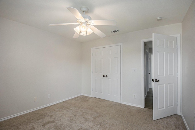 2109 Timber Cove Ct, Weatherford, TX 76087 - unfurnished bedroom featuring carpet floors, a closet, baseboards, and ceiling fan