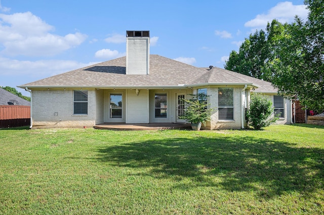 2109 Timber Cove Ct, Weatherford, TX 76087 - back of house with a chimney, brick siding, and roof with shingles