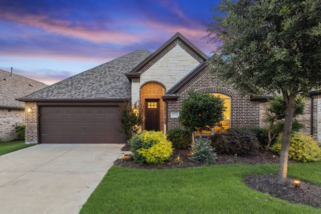 10113 Warberry Trl, Fort Worth, TX 76131 - french provincial home with brick siding, a garage, concrete driveway, a shingled roof, and a lawn