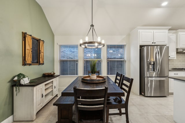 10113 Warberry Trl, Fort Worth, TX 76131 - dining space featuring a chandelier, vaulted ceiling, and light tile patterned floors