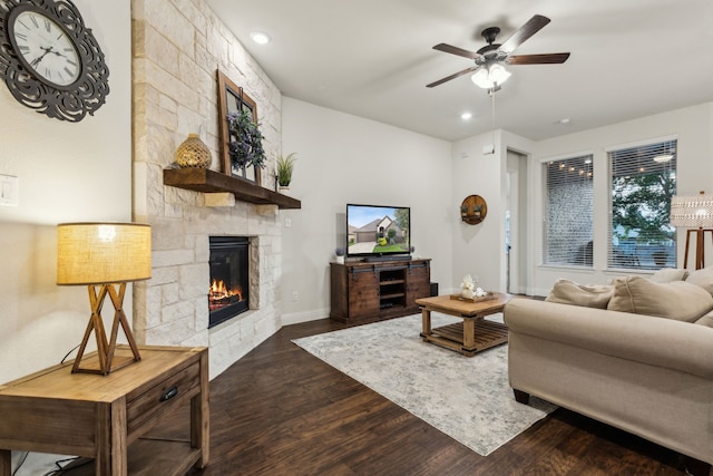 10113 Warberry Trl, Fort Worth, TX 76131 - living room featuring dark wood finished floors, a ceiling fan, a stone fireplace, recessed lighting, and baseboards