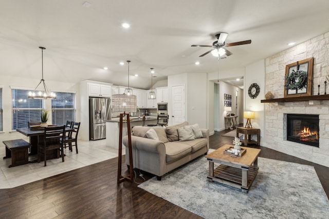 10113 Warberry Trl, Fort Worth, TX 76131 - living area featuring a fireplace, a chandelier, ceiling fan, recessed lighting, and light wood finished floors