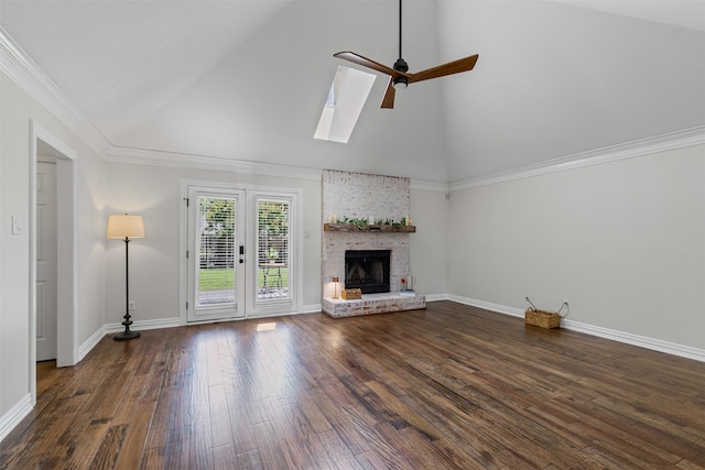 213 Redwood Ct, Keller, TX 76248 - unfurnished living room featuring a ceiling fan, high vaulted ceiling, dark wood finished floors, a skylight, and a brick fireplace