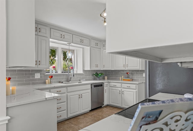 213 Redwood Ct, Keller, TX 76248 - kitchen featuring appliances with stainless steel finishes, a sink, tasteful backsplash, white cabinets, and light tile patterned floors