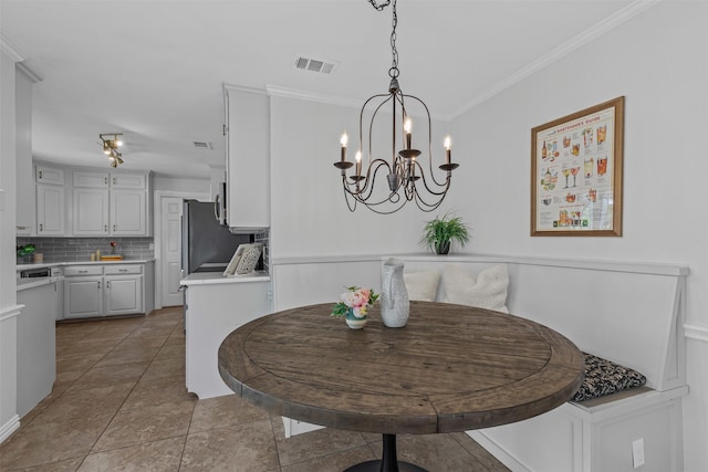 213 Redwood Ct, Keller, TX 76248 - dining area featuring ornamental molding and a chandelier