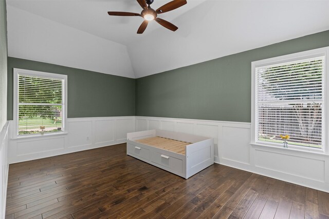 213 Redwood Ct, Keller, TX 76248 - empty room featuring ceiling fan, dark wood-style floors, wainscoting, and vaulted ceiling