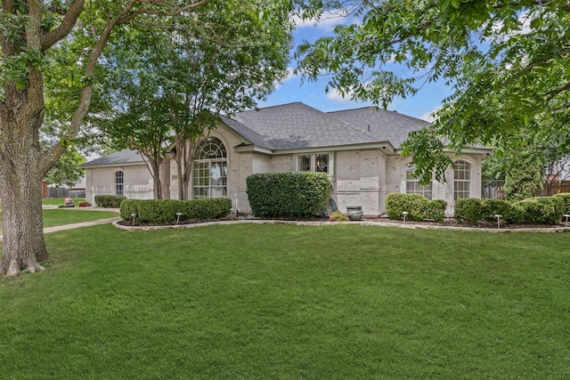 213 Redwood Ct, Keller, TX 76248 - view of front of house featuring a front yard, roof with shingles, and brick siding