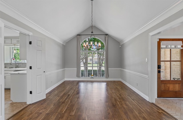 213 Redwood Ct, Keller, TX 76248 - unfurnished dining area featuring a chandelier, wood finished floors, vaulted ceiling, a sink, and baseboards