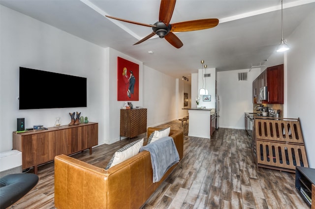 1122 Jackson St Unit 220, Dallas, TX 75202 - living room with a ceiling fan, dark wood finished floors, and baseboards