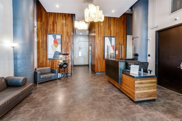 1122 Jackson St Unit 220, Dallas, TX 75202 - reception area featuring a chandelier, wooden walls, and recessed lighting