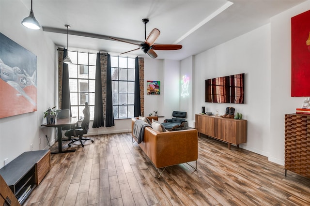 1122 Jackson St Unit 220, Dallas, TX 75202 - living room with wood finished floors, ceiling fan, a desk, and baseboards