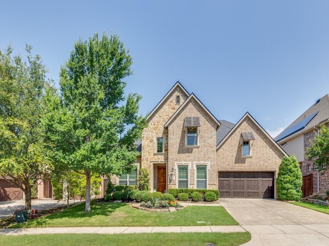2040 Grassland Dr, Allen, TX 75013 - traditional-style home featuring driveway, a front yard, a garage, and brick siding