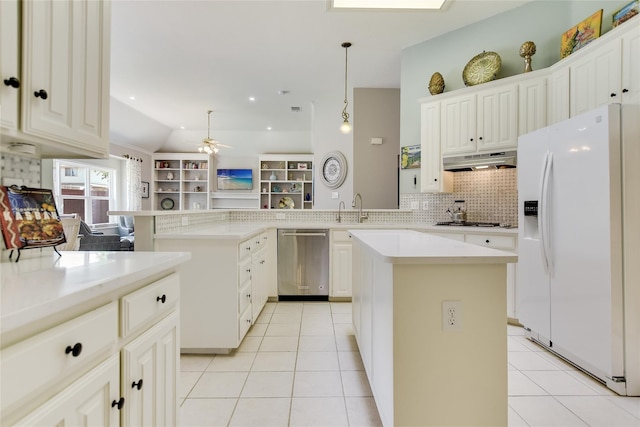 2772 Summertree Dr, Carrollton, TX 75006 - kitchen featuring stainless steel appliances, under cabinet range hood, a peninsula, decorative backsplash, and ceiling fan