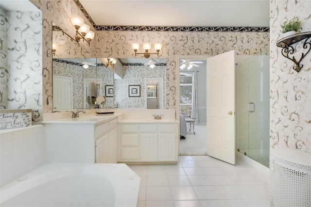 2772 Summertree Dr, Carrollton, TX 75006 - bathroom with wallpapered walls, a garden tub, double vanity, tile patterned floors, and a shower stall