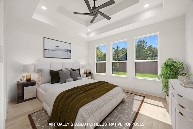 605 Utopia Rd, Tool, TX 75143 - bedroom featuring a tray ceiling, light wood-type flooring, recessed lighting, baseboards, and ceiling fan