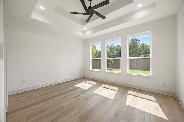 605 Utopia Rd, Tool, TX 75143 - empty room with a tray ceiling, baseboards, light wood-style floors, a ceiling fan, and recessed lighting