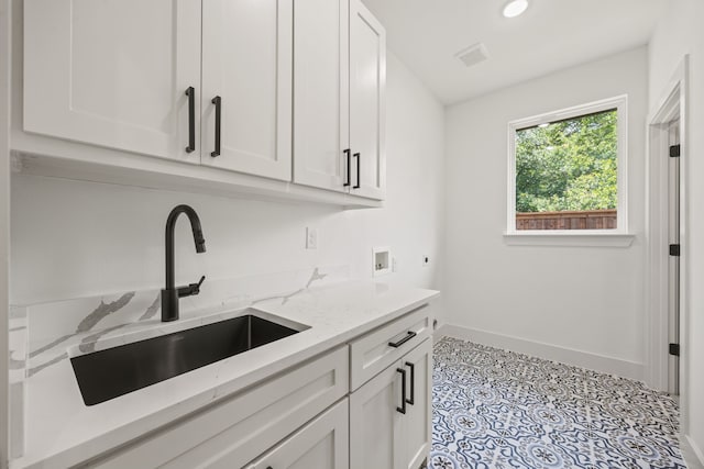 605 Utopia Rd, Tool, TX 75143 - laundry area with hookup for an electric dryer, hookup for a washing machine, cabinet space, baseboards, and recessed lighting