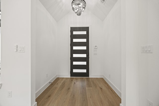 605 Utopia Rd, Tool, TX 75143 - foyer with wood finished floors, a chandelier, lofted ceiling, and baseboards