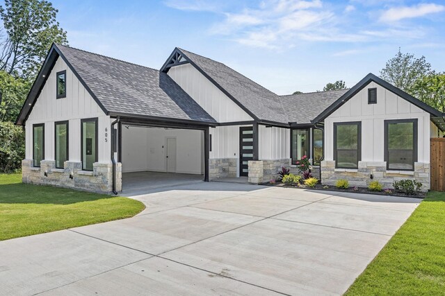 605 Utopia Rd, Tool, TX 75143 - modern farmhouse featuring driveway, a shingled roof, stone siding, and an attached garage