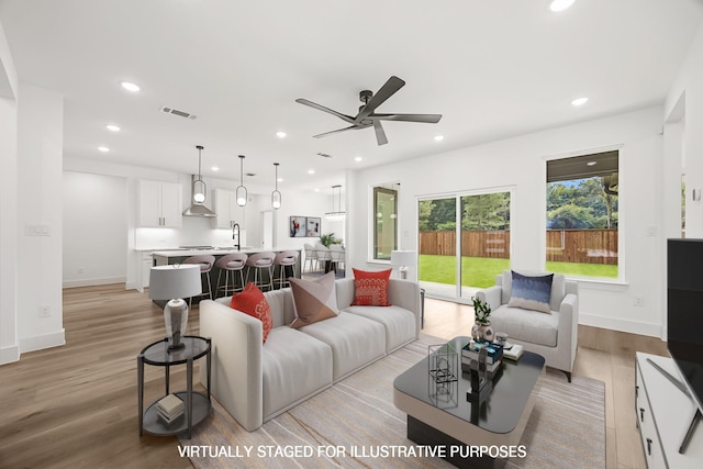 605 Utopia Rd, Tool, TX 75143 - living area featuring light wood-style floors, ceiling fan, recessed lighting, and baseboards