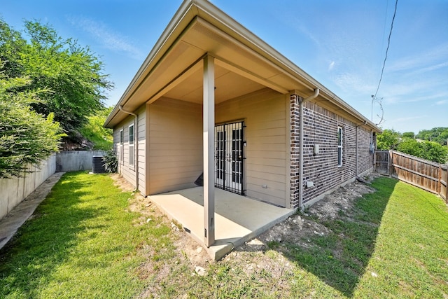 2901 18th St, Fort Worth, TX 76106 - view of property exterior featuring a patio area, cooling unit, and brick siding