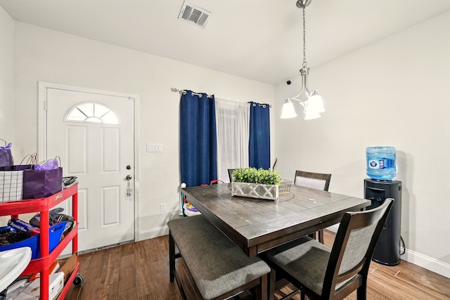 2901 18th St, Fort Worth, TX 76106 - dining area with a chandelier, baseboards, and wood finished floors