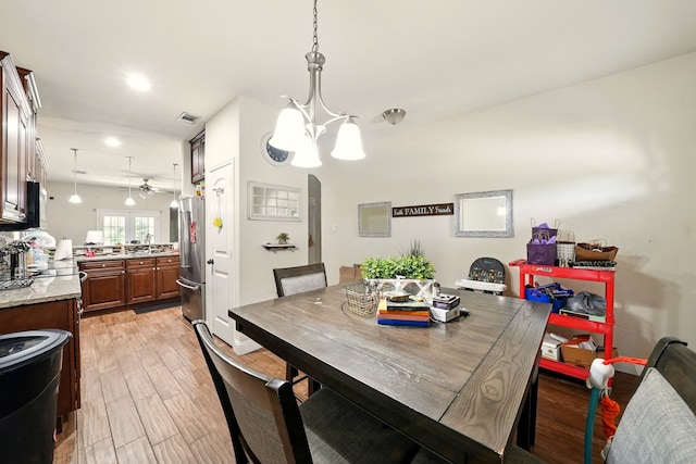 2901 18th St, Fort Worth, TX 76106 - dining room with ceiling fan, light wood-style floors, arched walkways, and recessed lighting