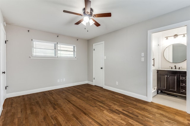 9139 Bretshire Dr, Dallas, TX 75228 - unfurnished bedroom with baseboards, wood finished floors, a sink, and ensuite bathroom