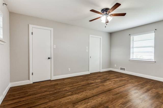 9139 Bretshire Dr, Dallas, TX 75228 - unfurnished bedroom with dark wood finished floors, baseboards, and a ceiling fan