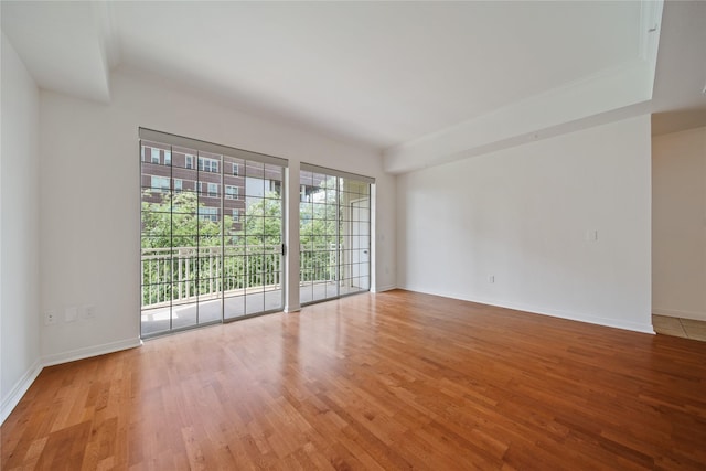 3225 Turtle Creek Blvd Unit 320, Dallas, TX 75219 - spare room with light wood-style floors and baseboards