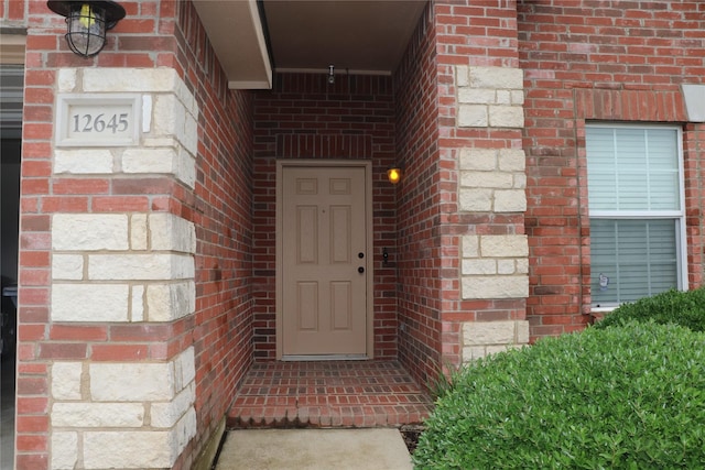 12645 Foxpaw Trl, Fort Worth, TX 76244 - doorway to property featuring brick siding