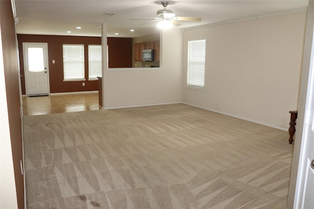 12645 Foxpaw Trl, Fort Worth, TX 76244 - unfurnished living room featuring light colored carpet, ceiling fan, baseboards, and recessed lighting