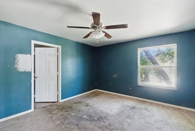 5608 Humbert Ave, Fort Worth, TX 76107 - empty room featuring carpet, a ceiling fan, and baseboards