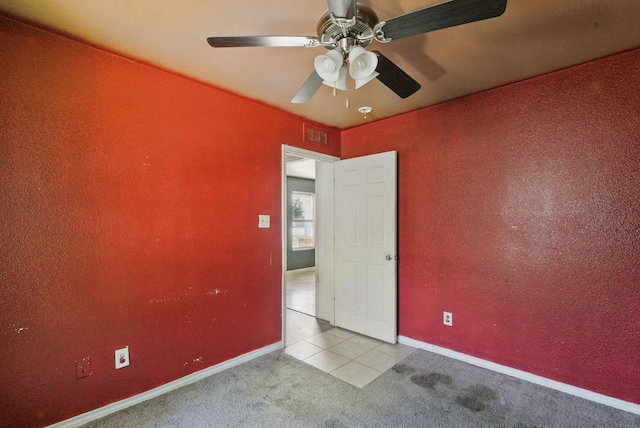 5608 Humbert Ave, Fort Worth, TX 76107 - tiled empty room with carpet flooring, ceiling fan, and baseboards