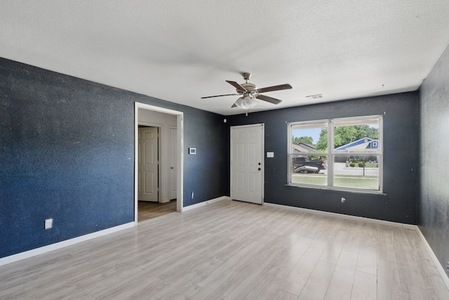 5608 Humbert Ave, Fort Worth, TX 76107 - spare room featuring a ceiling fan, wood finished floors, and baseboards