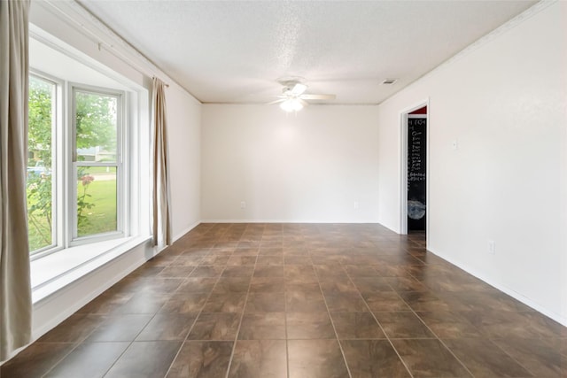 1619 Marquette Dr, Richardson, TX 75081 - unfurnished room with a ceiling fan, a textured ceiling, and dark tile patterned flooring