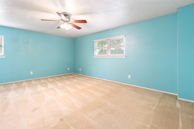 1619 Marquette Dr, Richardson, TX 75081 - empty room with light carpet, a ceiling fan, and baseboards